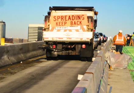Construction workers working on a highway.