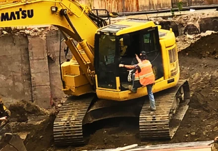 Yellow truck and a laborer.