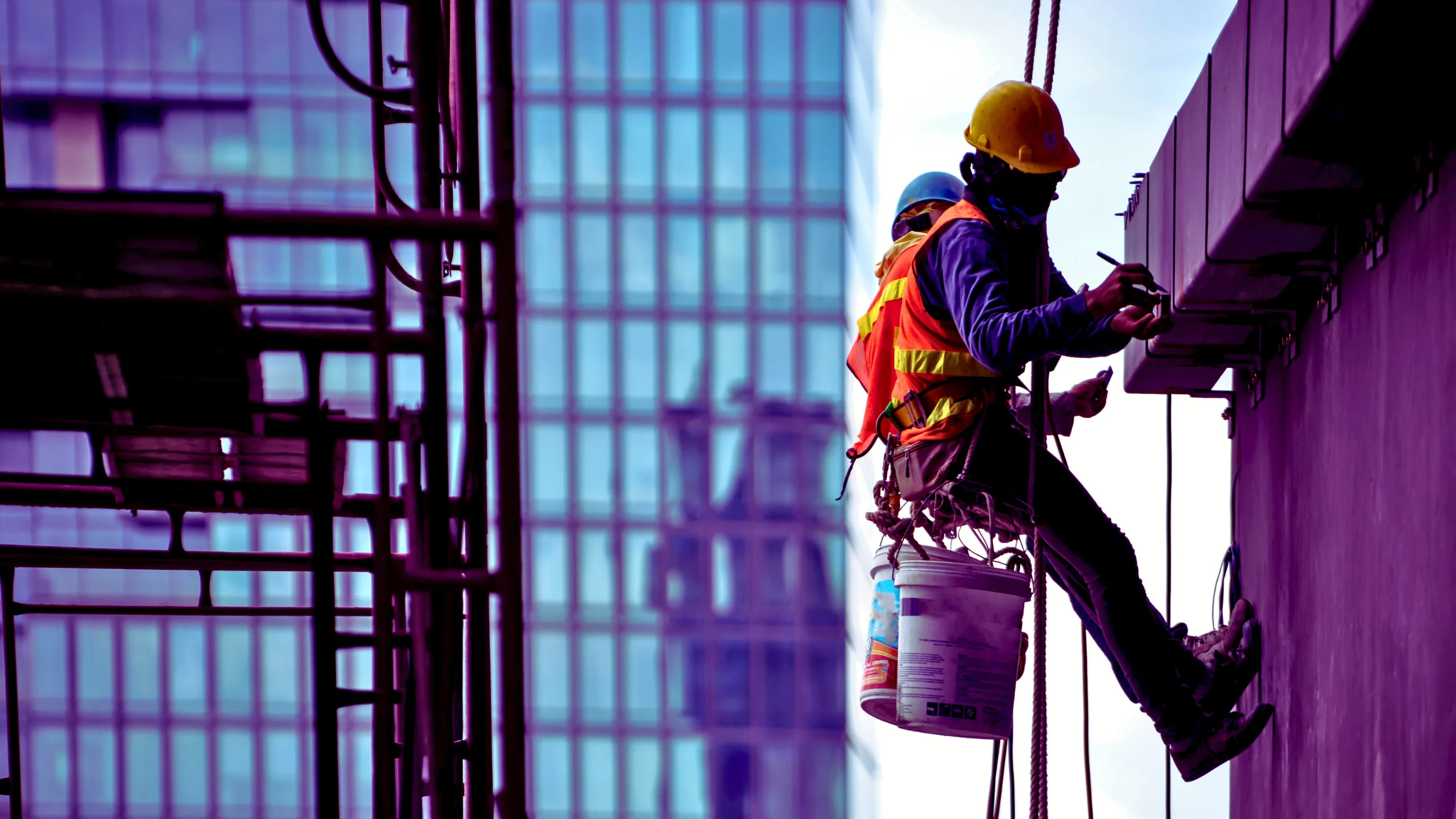 Laborers working on a building.