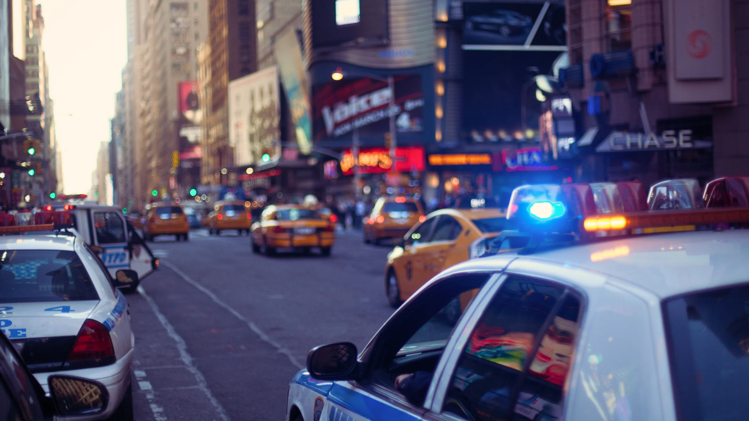 Rear-End, Lane Change, and Driveway Accident Fault in NY 1 Police car patrolling the city.