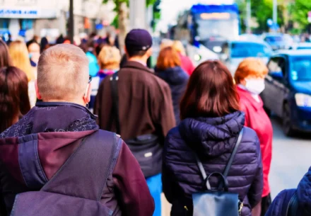 Pedestrians on a busy street.