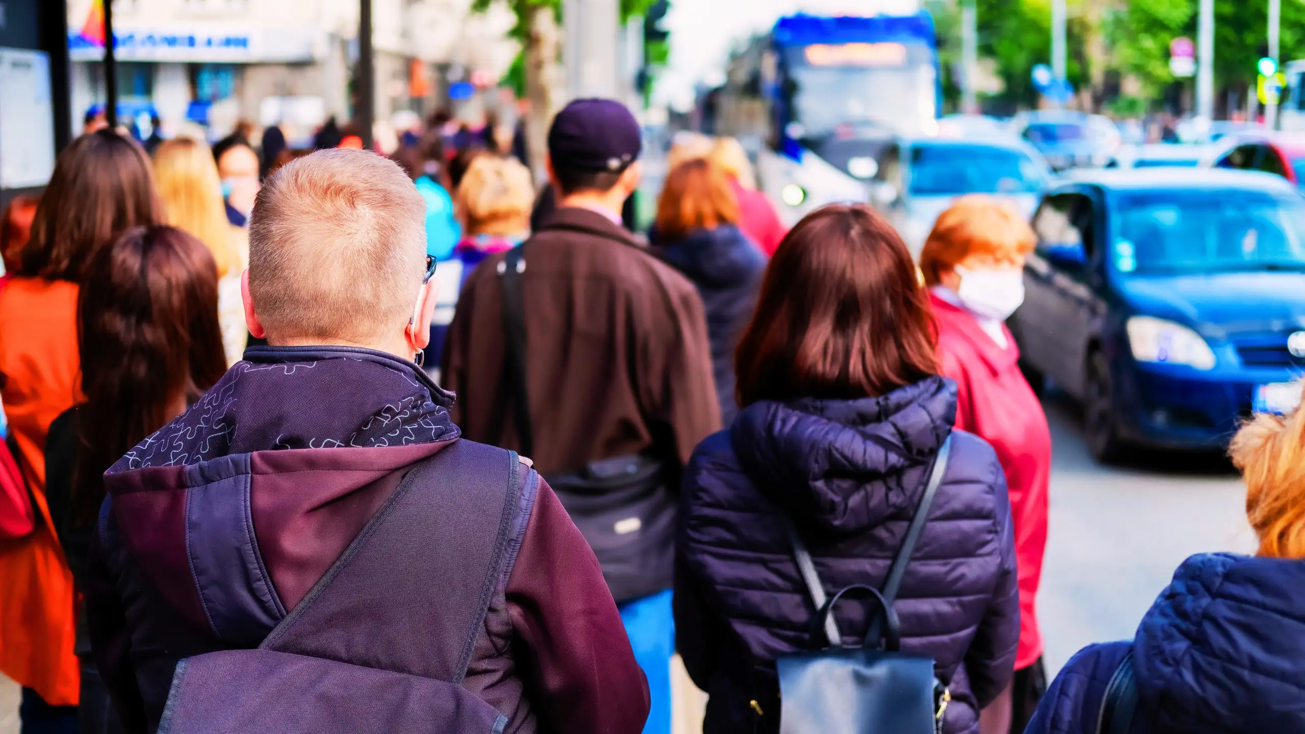 Pedestrians on a busy street.