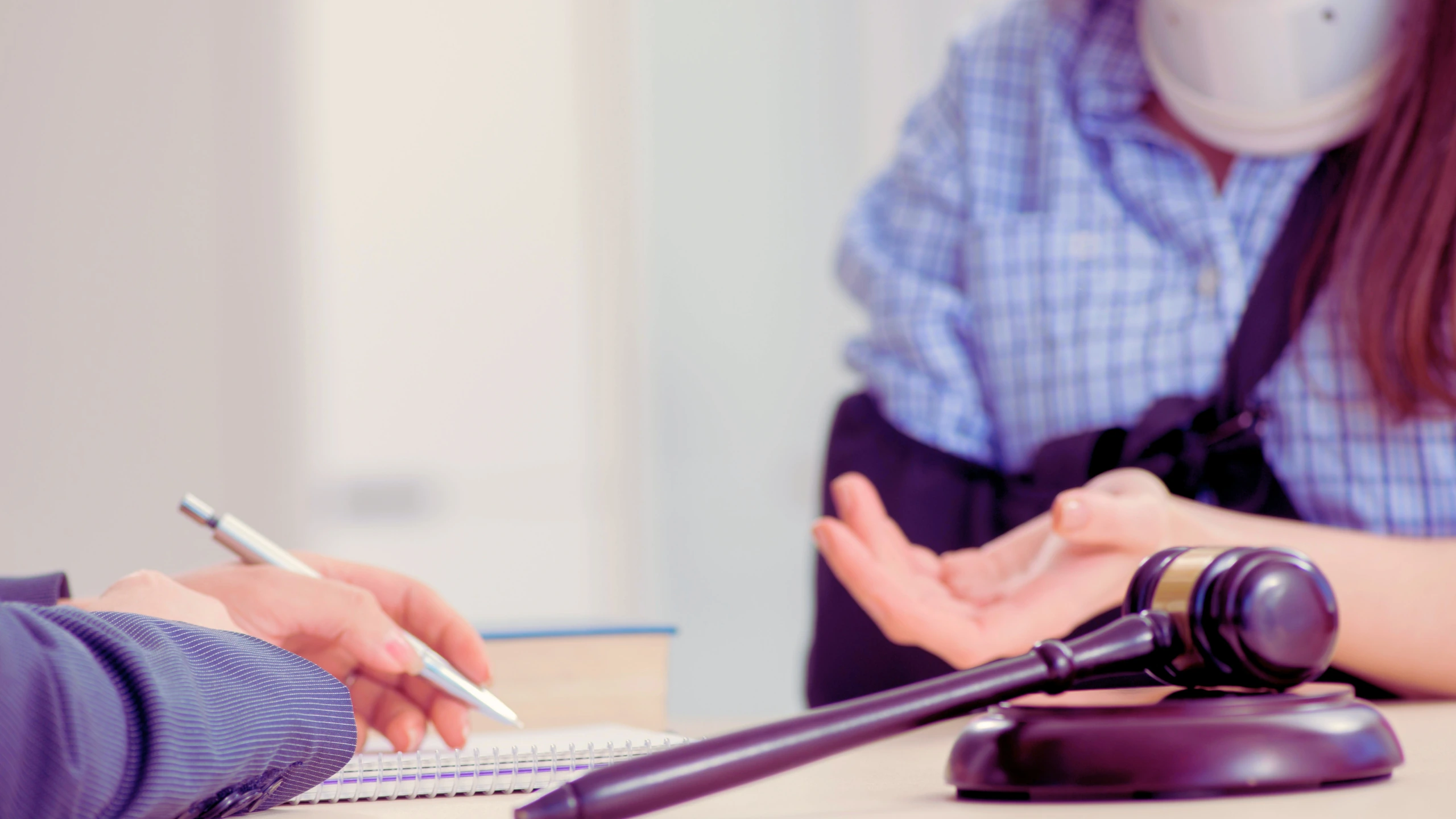 Aggravation And Exacerbation Of Pre-Existing Injuries 1 Injured woman talking to her lawyer.