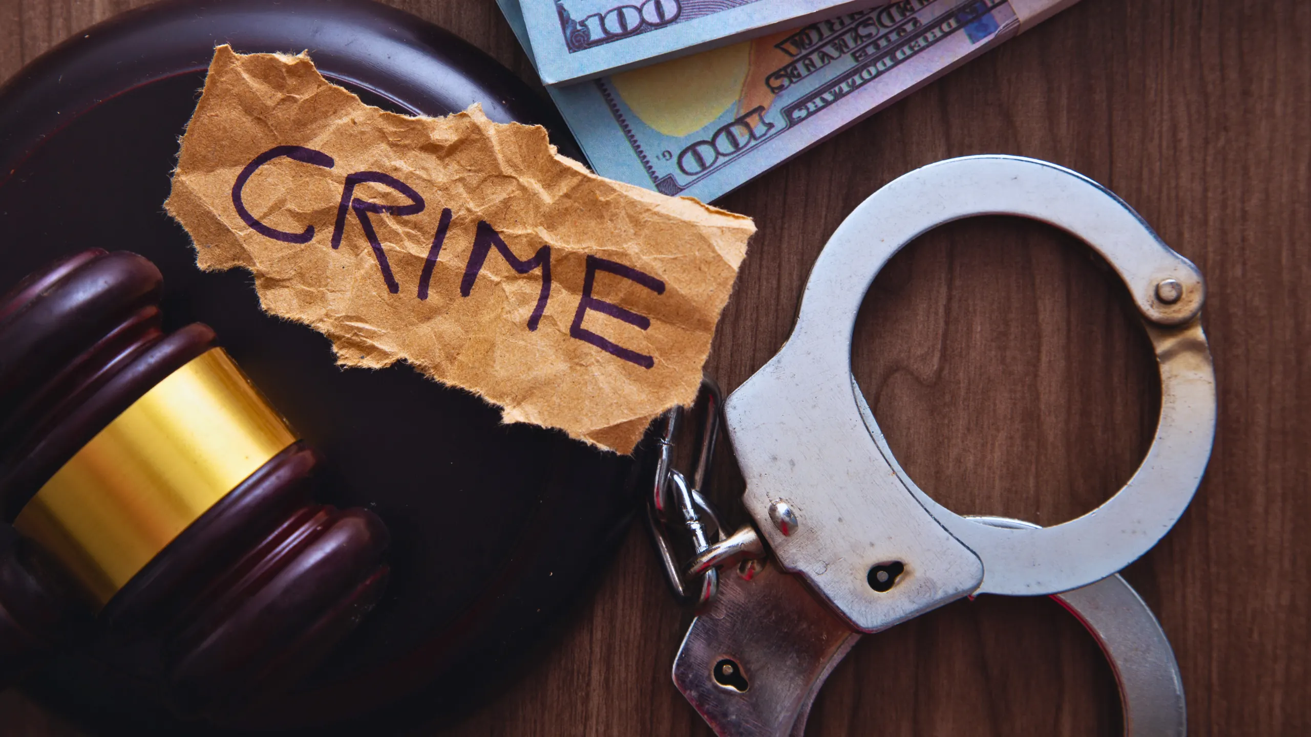 Criminal Law Recap for November 2014 1 The word "CRIME" written on a piece of torn brown paper, placed next to a judge's gavel, handcuffs, and US dollar bills.
